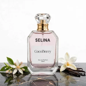 Selina Eau de Parfum 50ml by CocoBerry in a clear glass bottle with a gold spray cap, displayed with white orange blossom flowers and vanilla beans – YSL Libre Intense Impression Perfume