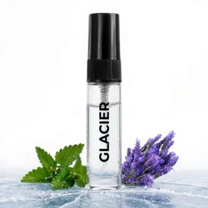 CocoBerry Glacier 5ml tester perfume bottle placed on an icy surface with fresh mint leaves and lavender.