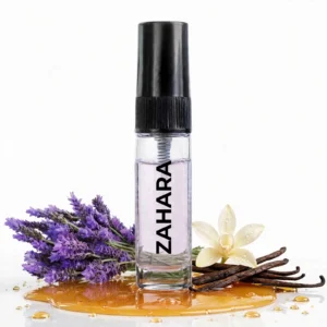 CocoBerry Zahara 5ml tester perfume bottle displayed in a pool of golden amber liquid, paired with fresh lavender sprigs, vanilla beans, and a vanilla flower.